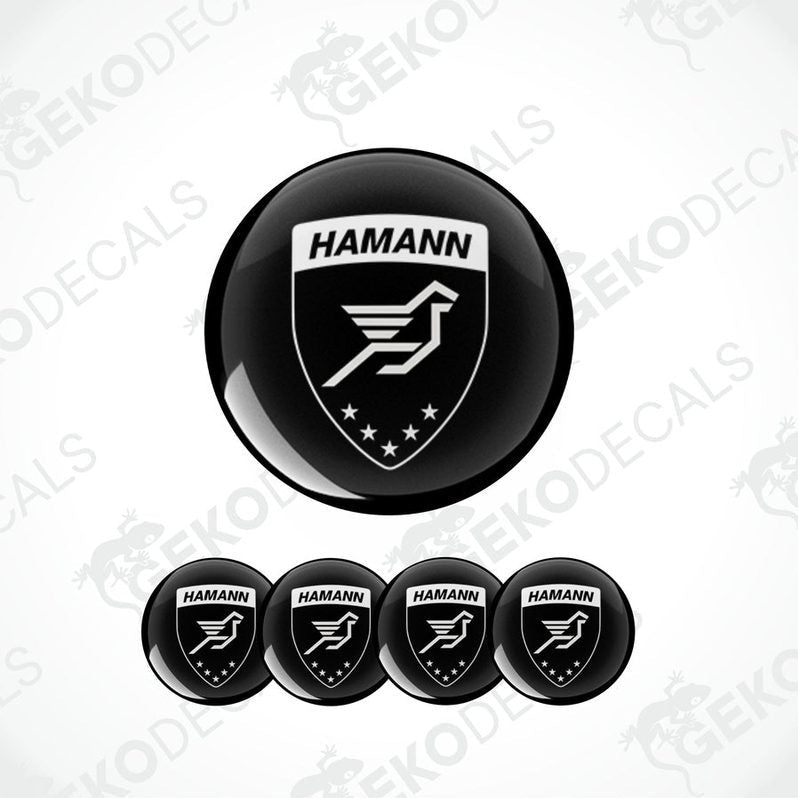 A set of four black vinyl stickers with the HAMANN brand logo featuring a bird and stars design.