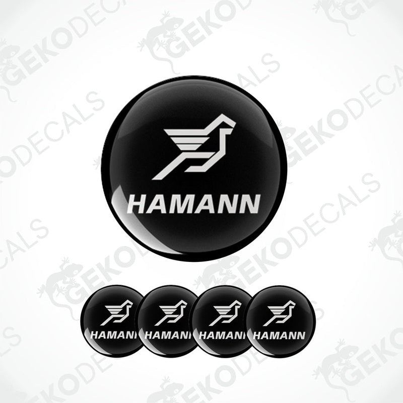A set of four black vinyl stickers with the HAMANN brand logo and a bird symbol on them.