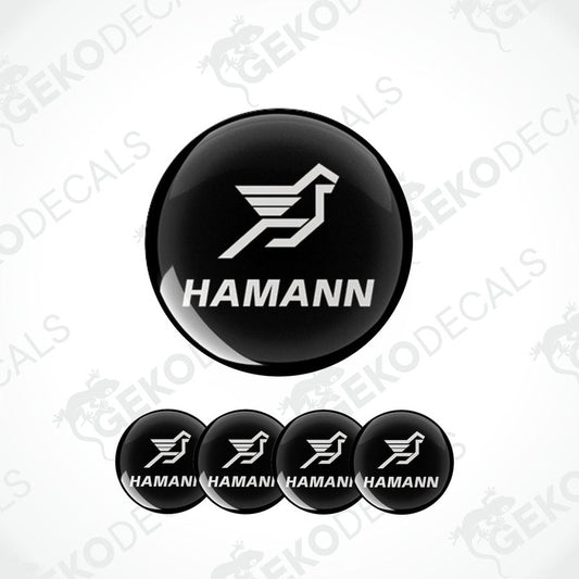 A set of four black vinyl stickers with the HAMANN brand logo and a bird symbol on them.