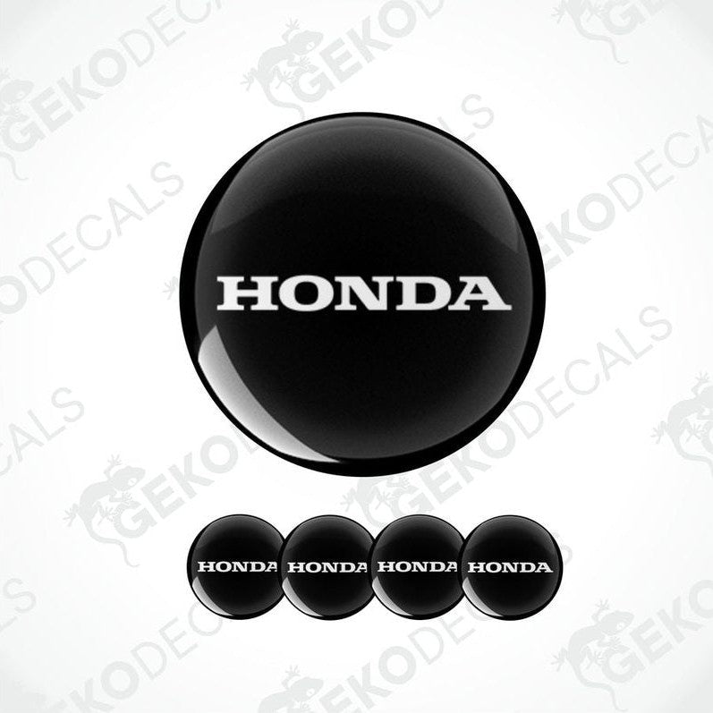 A set of four white and red vinyl decals with the HONDA logo.