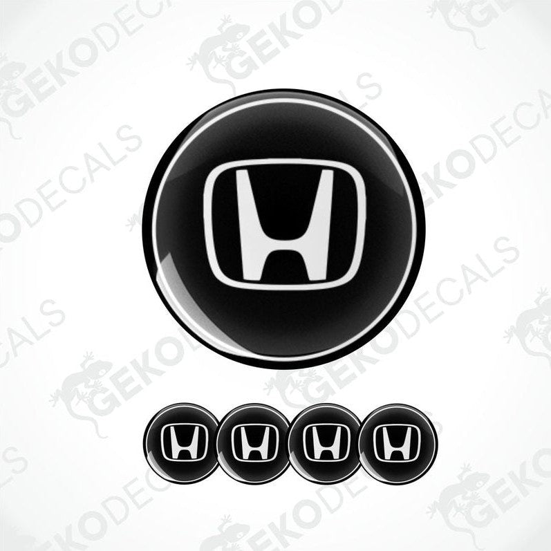 A set of four black and white vinyl decals with the HONDA logo.