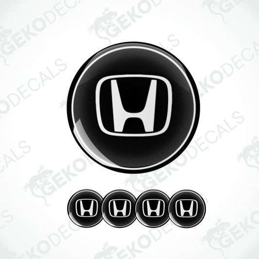 A set of four black and white vinyl decals with the HONDA logo.