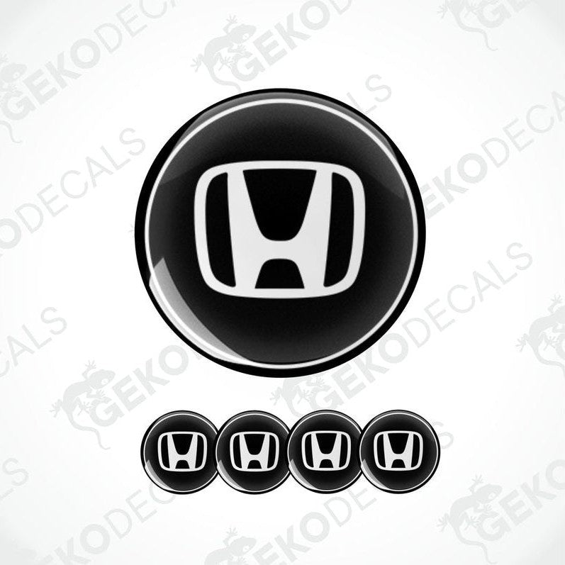A set of four black and white vinyl decals with the HONDA logo.