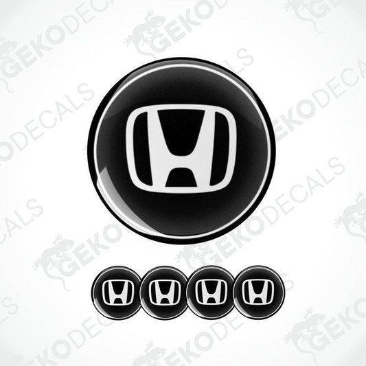 A set of four black and white vinyl decals with the HONDA logo.