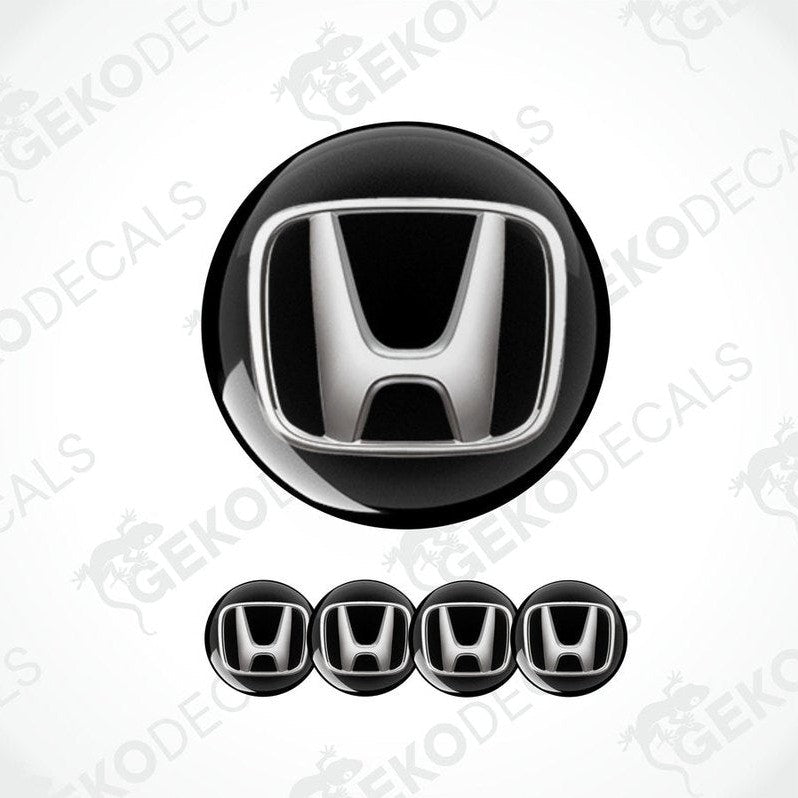 A set of black vinyl decals with the HONDA logo, designed for use as car wheel caps and stickers.