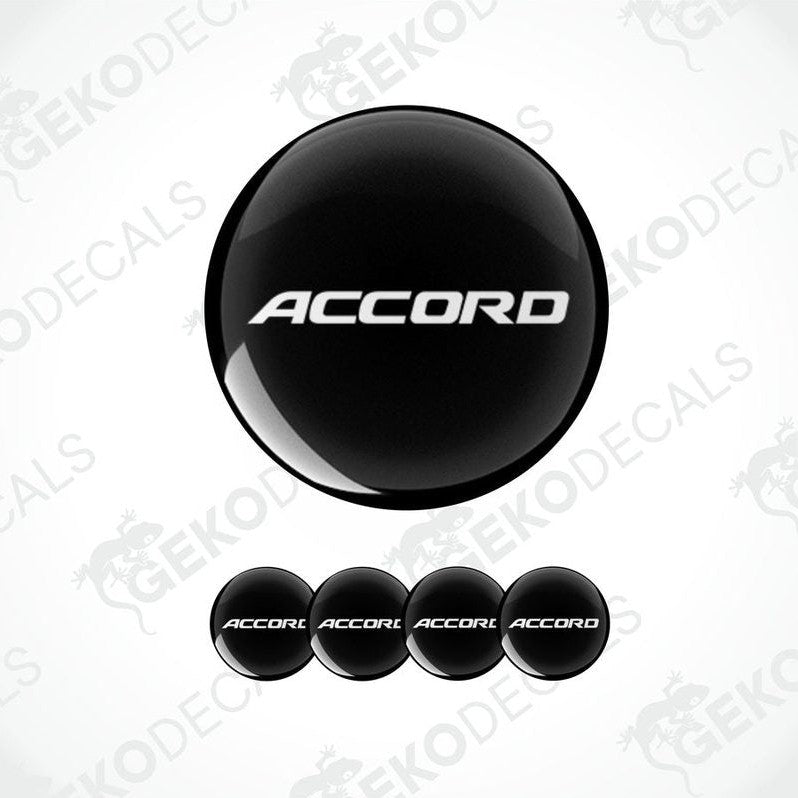 A set of black vinyl decals with the text 'ACCORD' on them, typically used as car wheel caps.