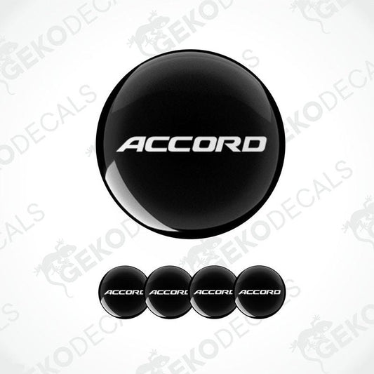 A set of black vinyl decals with the text 'ACCORD' on them, typically used as car wheel caps.