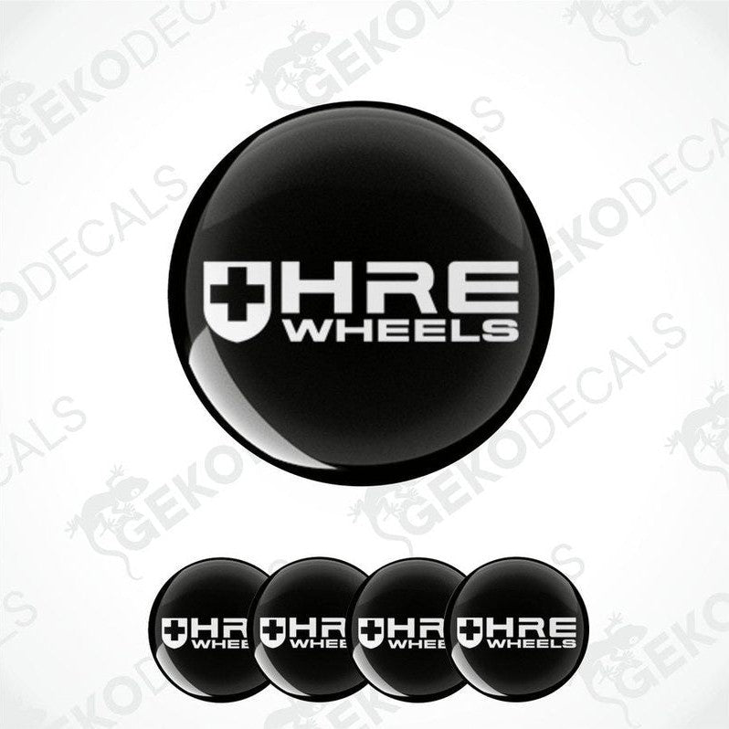 A set of four black vinyl stickers with the HRE Performance Wheels logo, which includes a cross and the brand name.