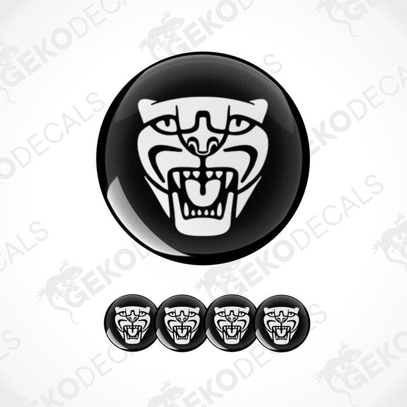 A set of four black vinyl stickers with a white jaguar decal design, displayed against a white background.