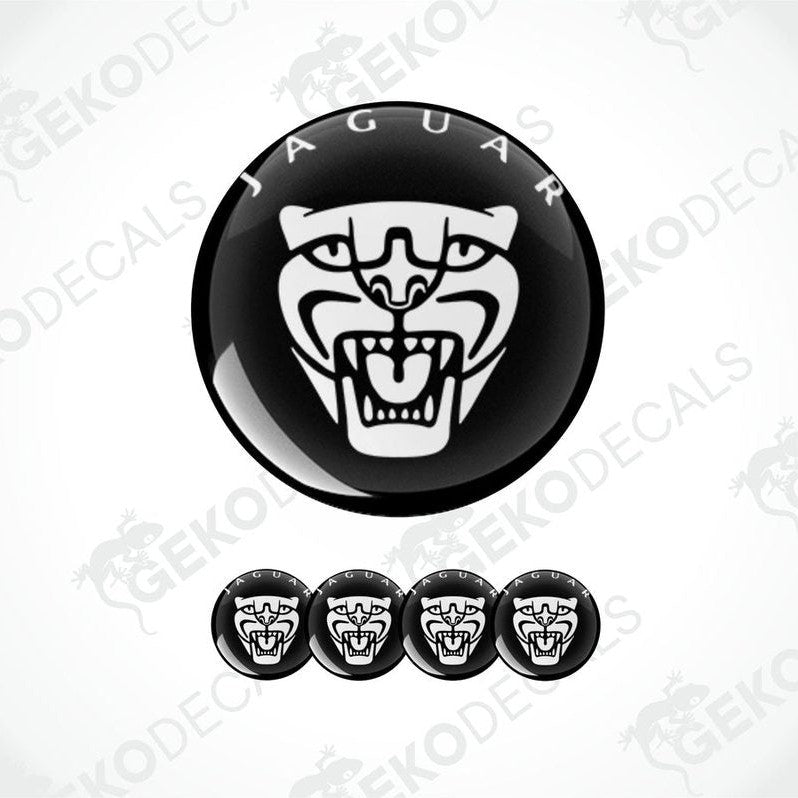 A set of black and white vinyl decals with a Jaguar logo, including four dome-shaped stickers.