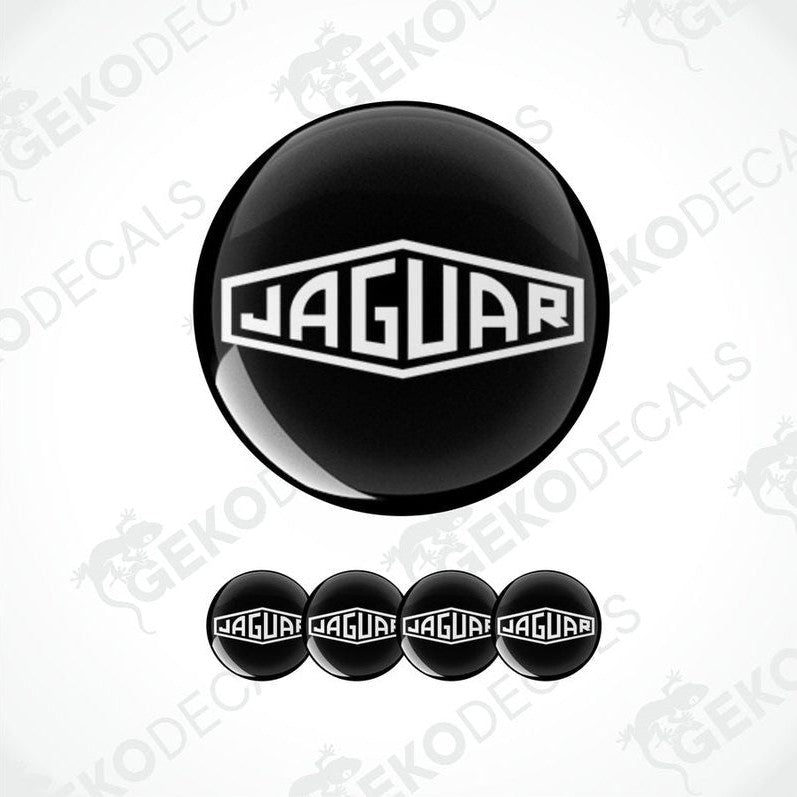 A set of black vinyl decals with the Jaguar logo applied on a white background, intended for use as car stickers.