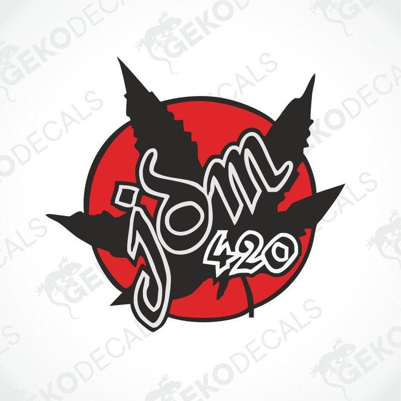 A car decal featuring stylized text and leaf graphics on a red background.