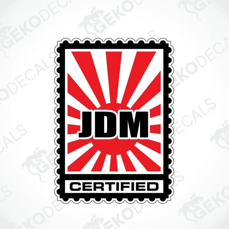 A decal with a red and black design featuring the text 'JDM' and 'CERTIFIED' with japanese rising sun design on a white background.