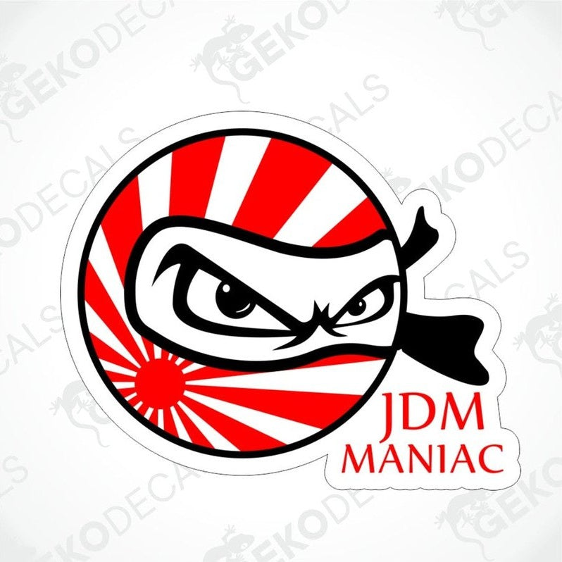 A car sticker with a graphic design depicting a stylized face with a black bandana and the text 'JDM MANIAC' in red and white.