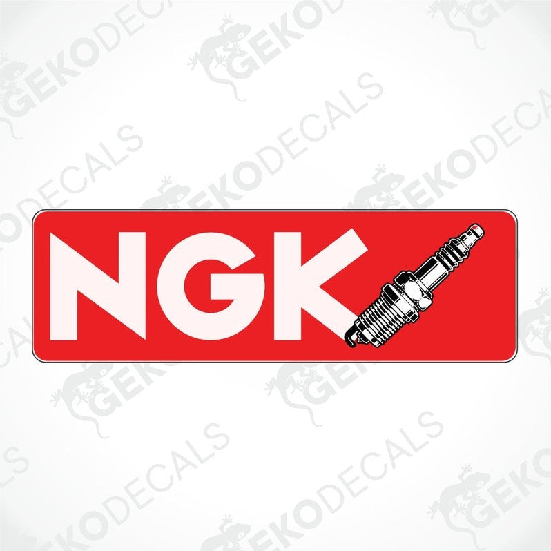 A red car decal with the brand 'NGK' , a sparkplug on red background. 