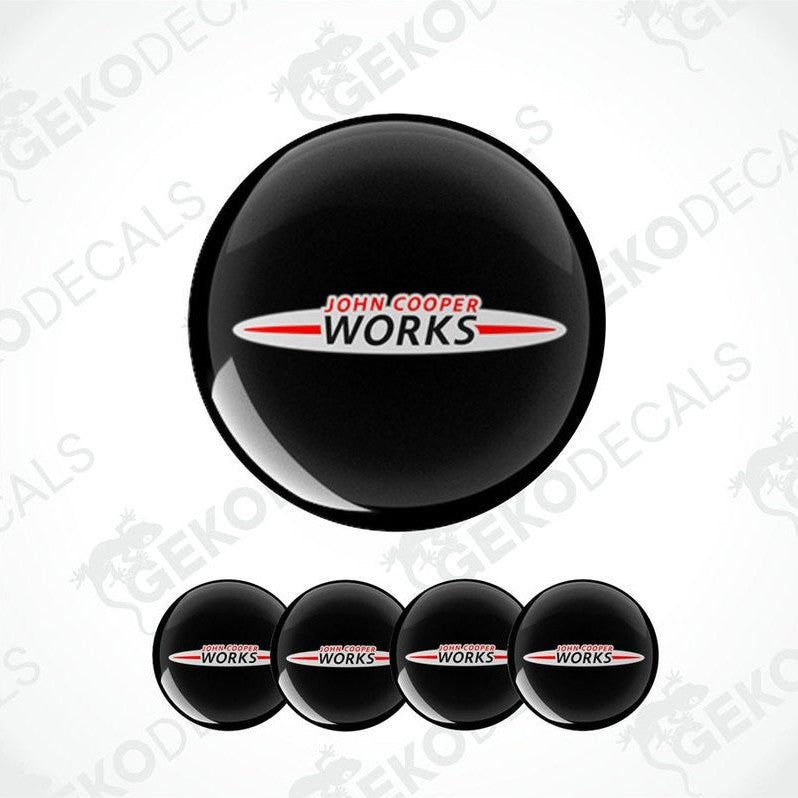 A set of black vinyl decals with the 'John Cooper Works' logo in white and red.