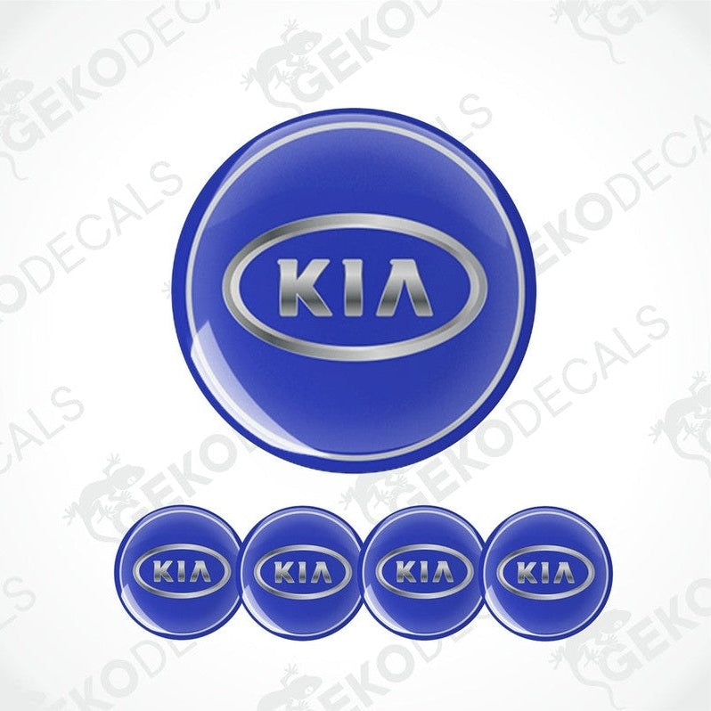 A set of four blue vinyl decals with the KIA logo, designed for use as car wheel caps.
