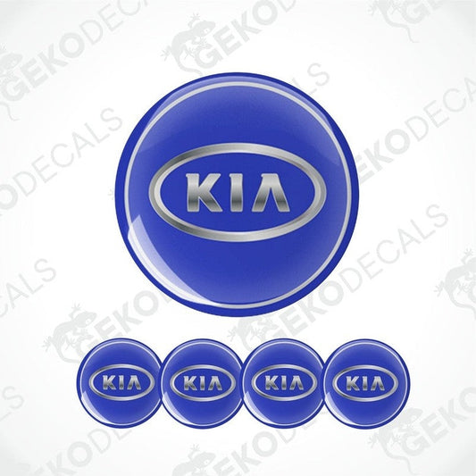 A set of four blue vinyl decals with the KIA logo, designed for use as car wheel caps.