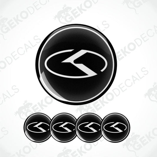 A set of four black vinyl stickers with a dome shape and the KIA brand logo in the center.