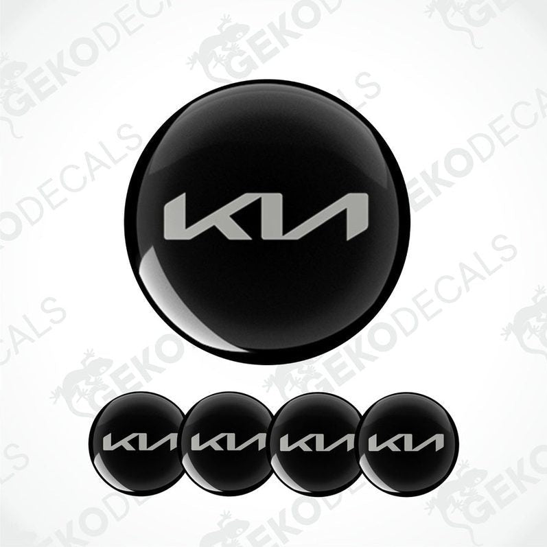 A set of four black vinyl decals with the KIA logo.