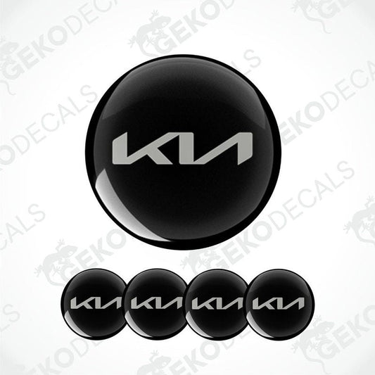 A set of four black vinyl decals with the KIA logo.