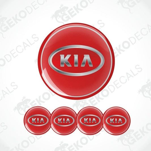 A set of four red vinyl decals with the KIA logo applied on a white background.