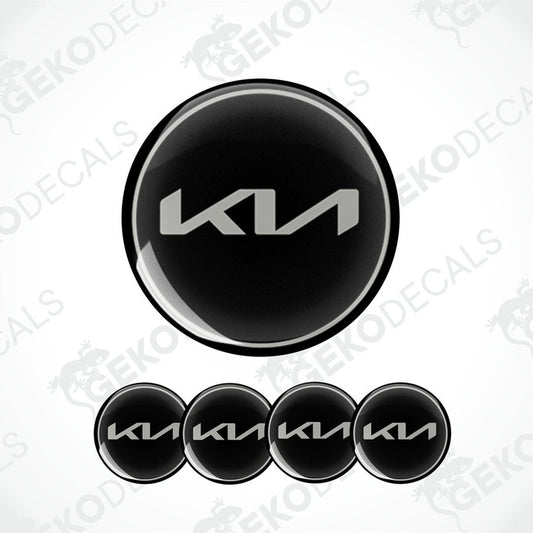 A set of four black vinyl decals with the KIA logo.
