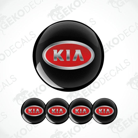 A set of four black vinyl stickers with the KIA brand logo in red and metallic grey.