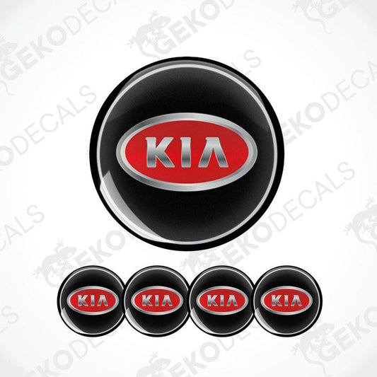 A set of four black vinyl stickers with the KIA brand logo in red and metallic grey.