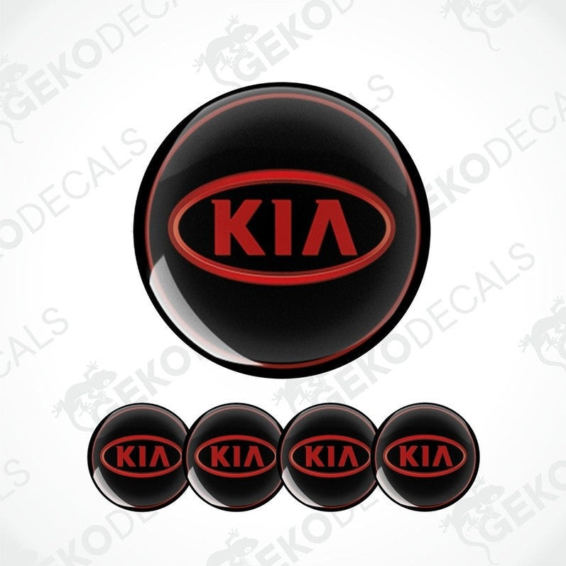 A set of four black vinyl stickers with the KIA brand logo in red.