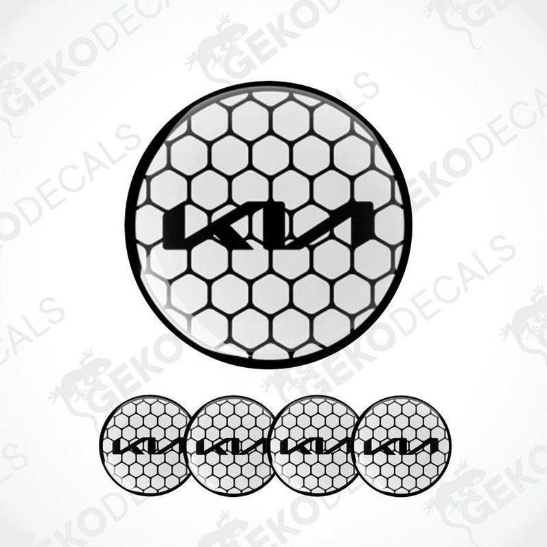A set of four black vinyl stickers with a white KIA logo, designed for use as car decals.