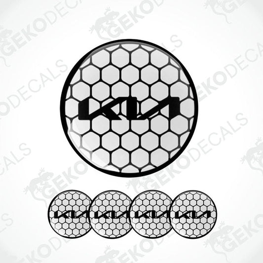 A set of four black vinyl stickers with a white KIA logo, designed for use as car decals.