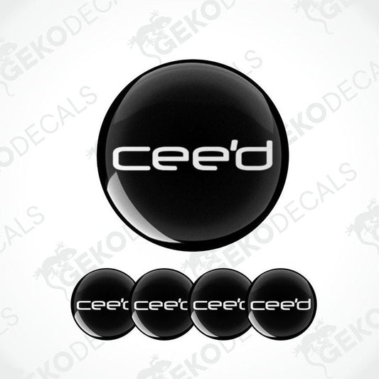 A set of four black vinyl stickers with the word 'KIA CEED' and a geometric design.
