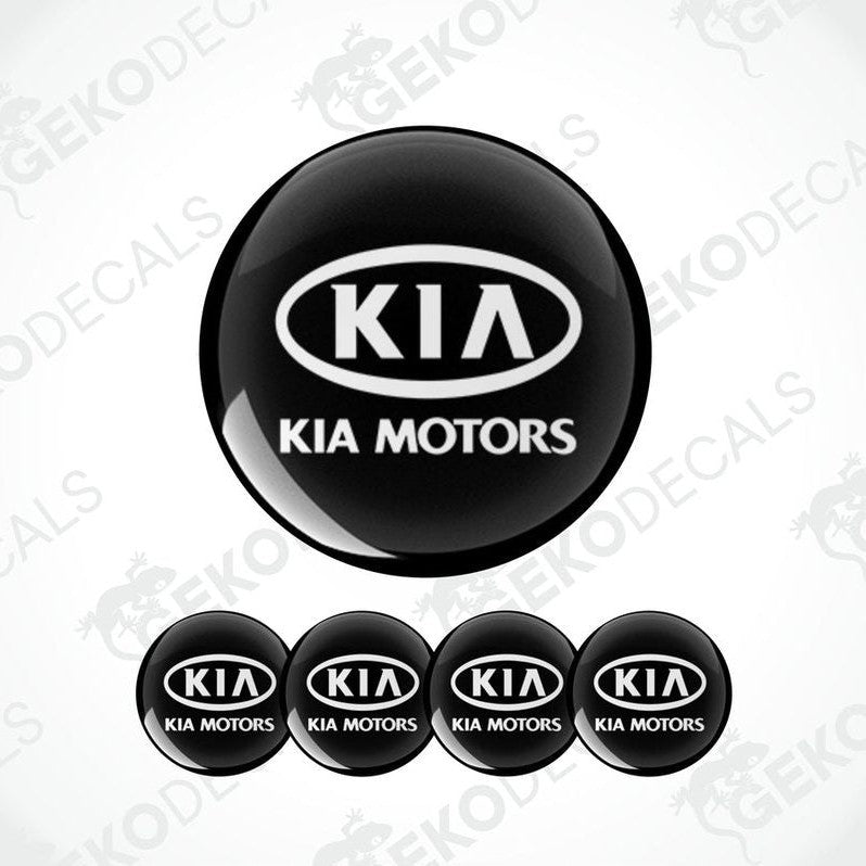 A set of four black vinyl stickers with the Kia Motors logo in white.