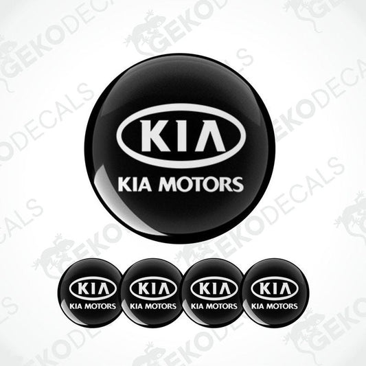 A set of four black vinyl stickers with the Kia Motors logo in white.