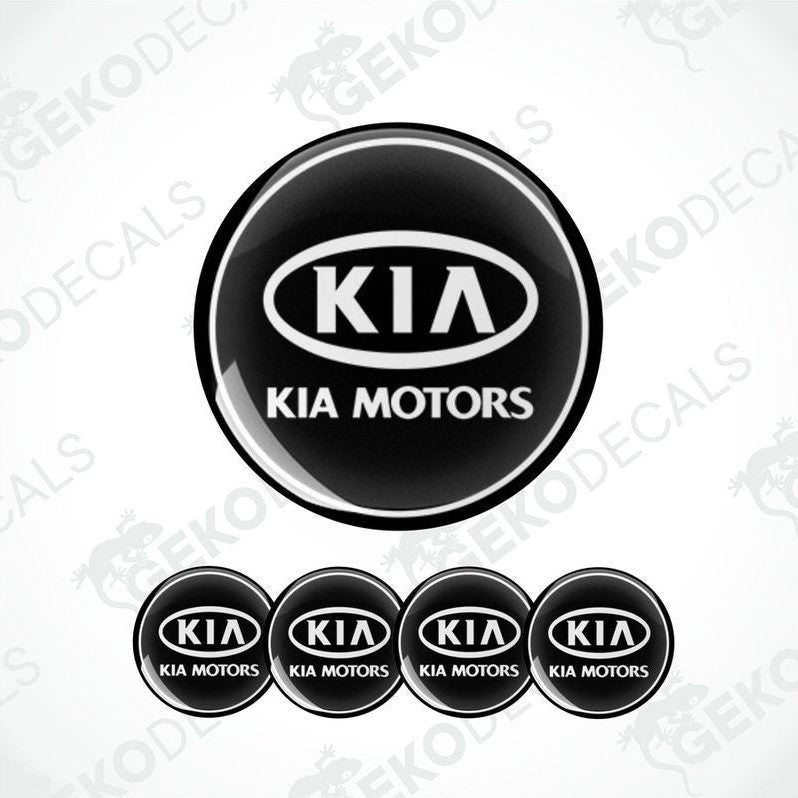 A set of four black vinyl stickers with the Kia Motors logo in white.