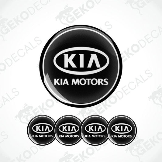 A set of four black vinyl stickers with the Kia Motors logo in white.