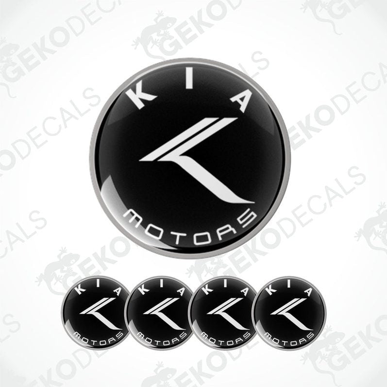 A set of four black and white Kia Motors vinyl decals.