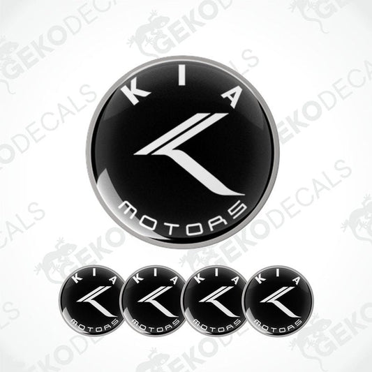 A set of four black and white Kia Motors vinyl decals.