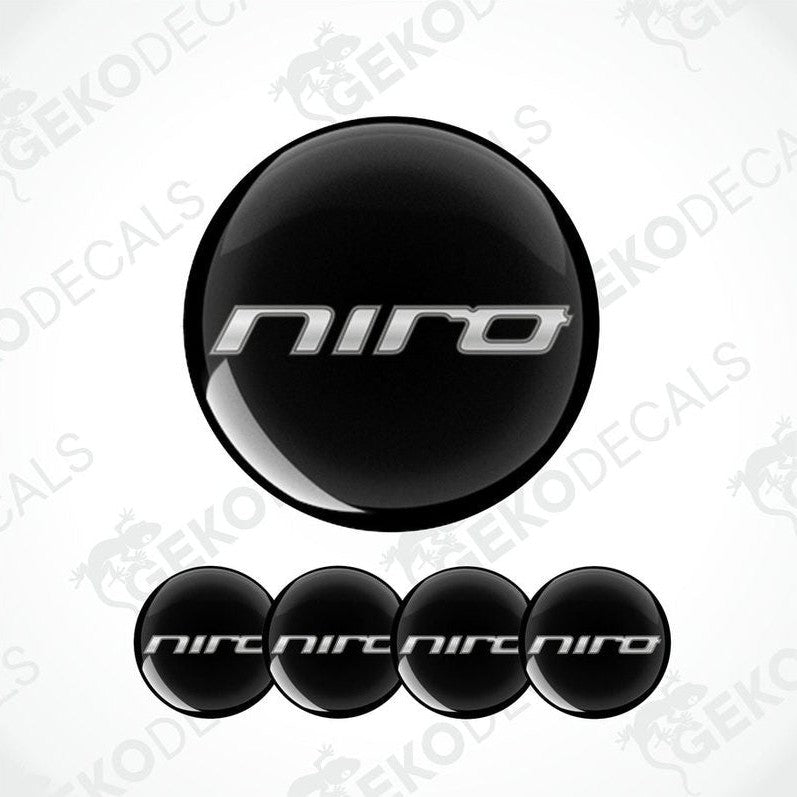 A set of four black vinyl stickers with the word 'KIA NIRO' and a geometric design.