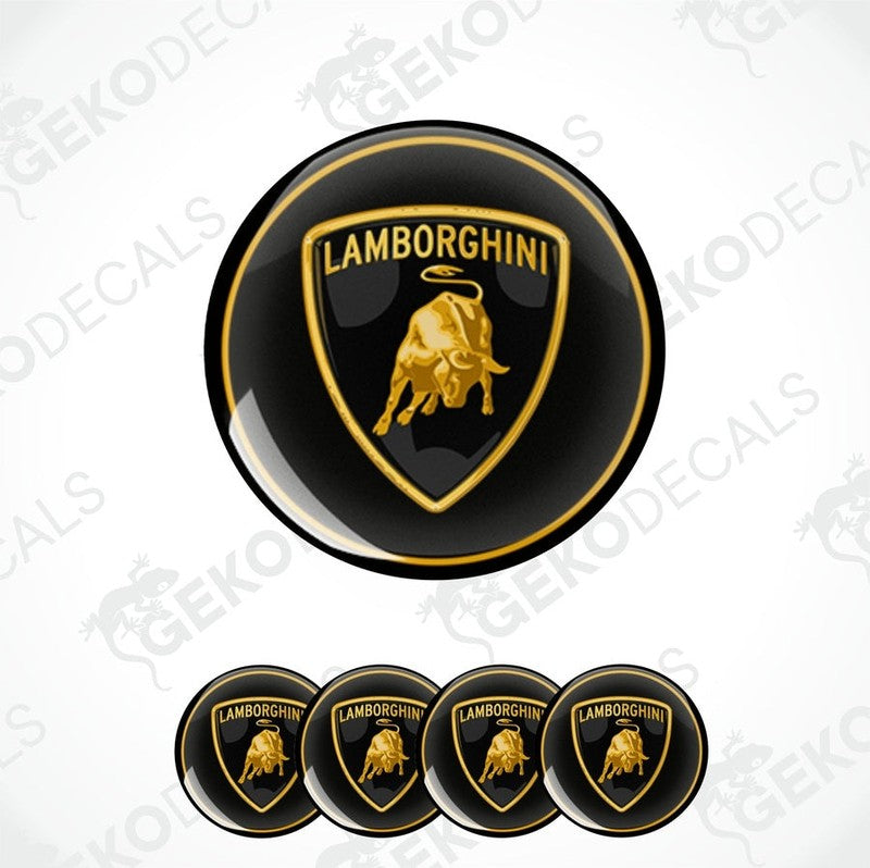 A set of four black vinyl stickers with the Lamborghini logo in gold, displayed on a white background.