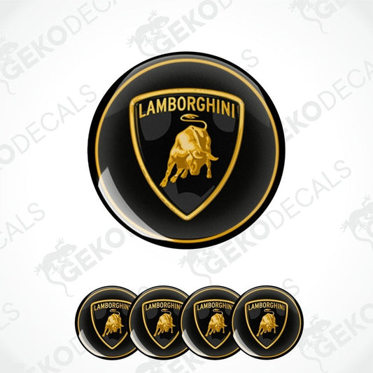 A set of four black vinyl stickers with the Lamborghini logo in gold, displayed on a white background.