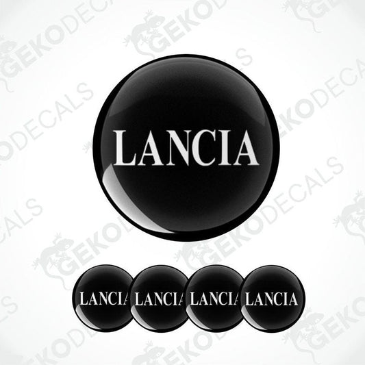 A set of four black vinyl stickers with the word 'LANCIA' printed on each, arranged in a circular pattern with a white background.