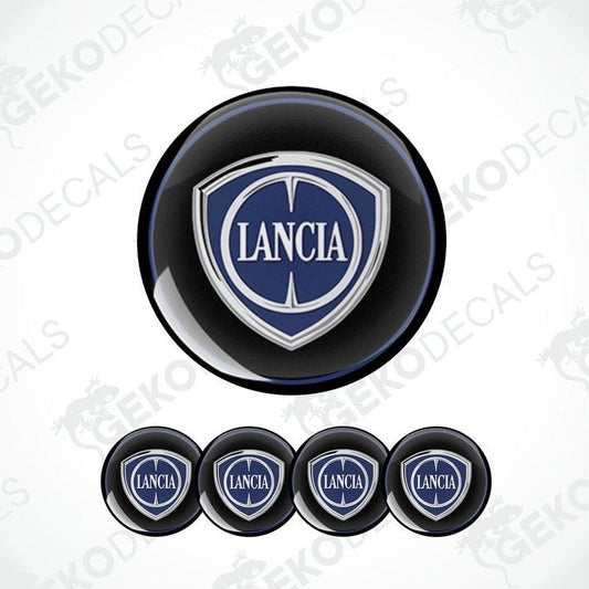 A set of four black vinyl stickers with the LANCIA brand logo in white and blue.