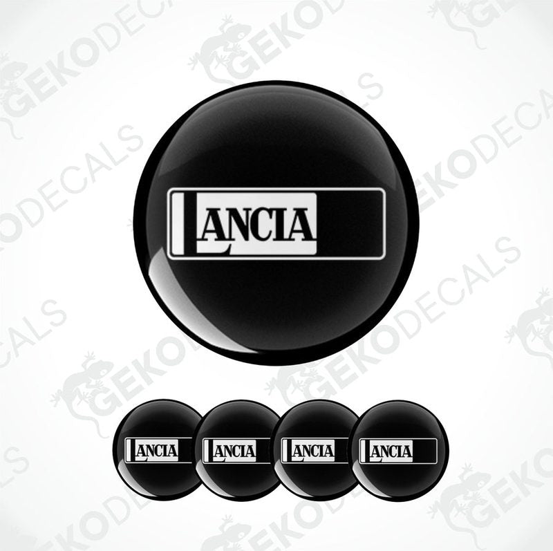 A set of four black vinyl stickers with the word 'LANCIA' printed on them, designed to be used as car decals.