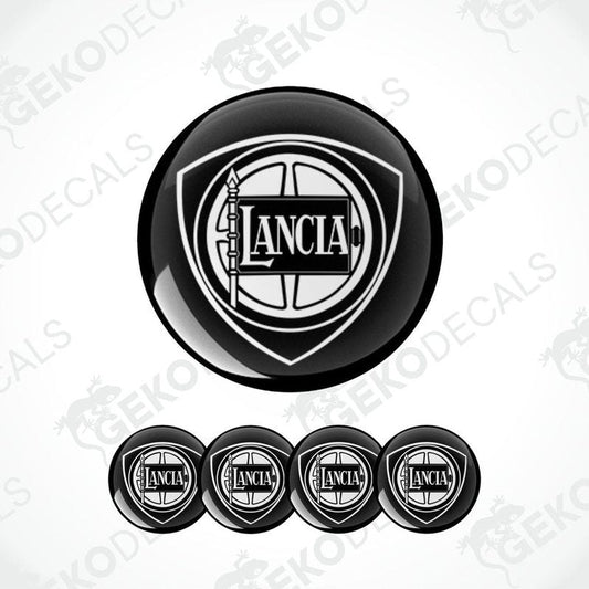 A set of four black vinyl stickers with the LANCIA brand logo, designed in the shape of a basketball.