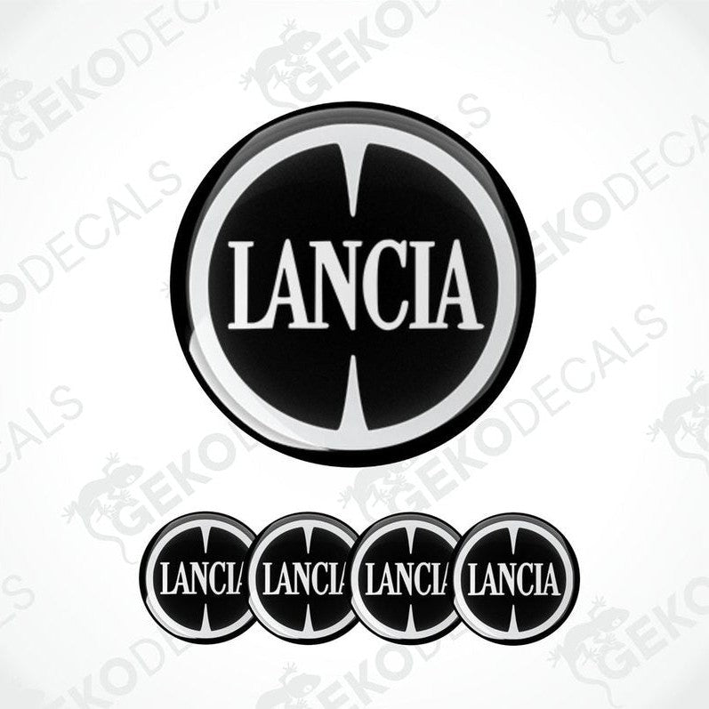 Set of four black and white vinyl decals with the LANCIA logo, three are circular and one is rectangular with a logo.
