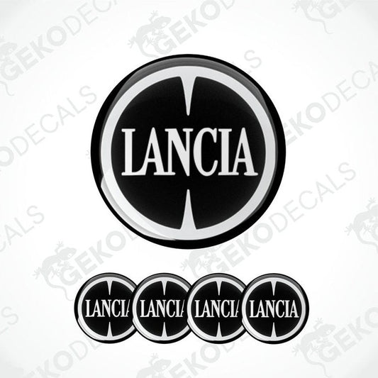 Set of four black and white vinyl decals with the LANCIA logo, three are circular and one is rectangular with a logo.