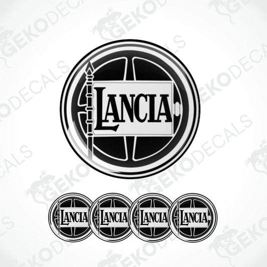 A set of four black vinyl stickers with the LANCIA brand logo, designed in a circular domed shape for use as car decals.