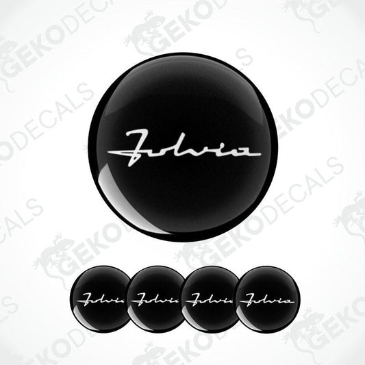 Set of four black vinyl decals with the text 'LANCIA FABIA' on them, presented against a white background.